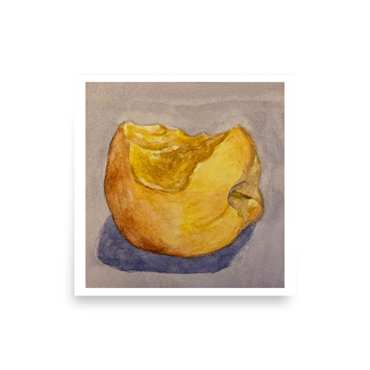 Product mockup of a watercolor painting that depicts a golden apple with a bite taken out of it against a greyish background.