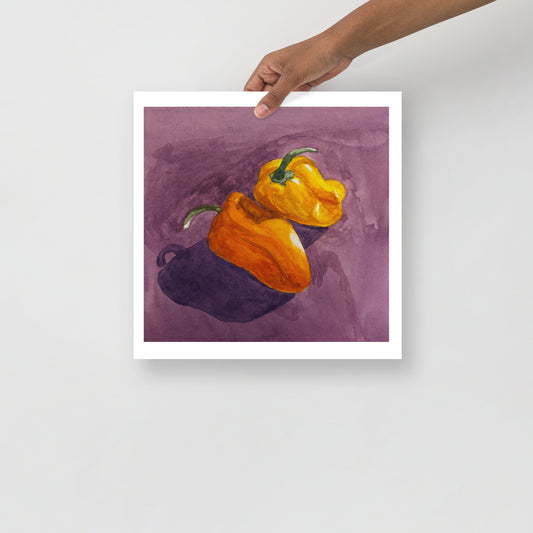 Product mockup of Two peppers, one orange and one yellow, on a purple background