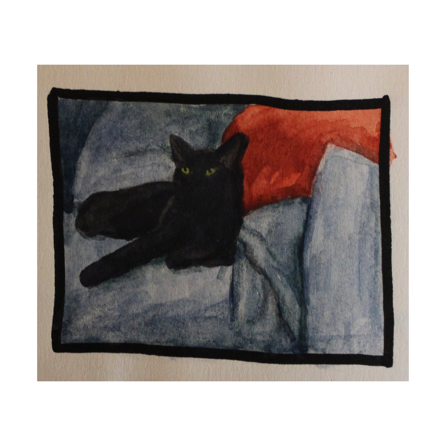 Black cat lying on a textured blanket with a red pillow