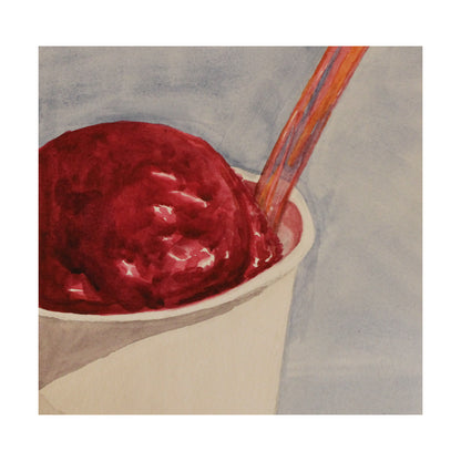 Raspberry gelato in a cup with a spoon on a light gray background