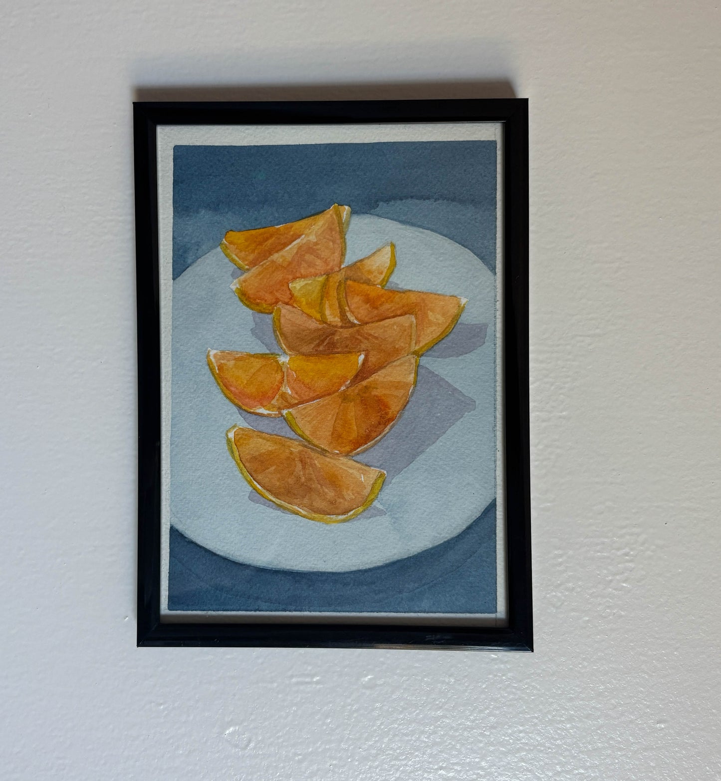 Sliced Oranges on Blue