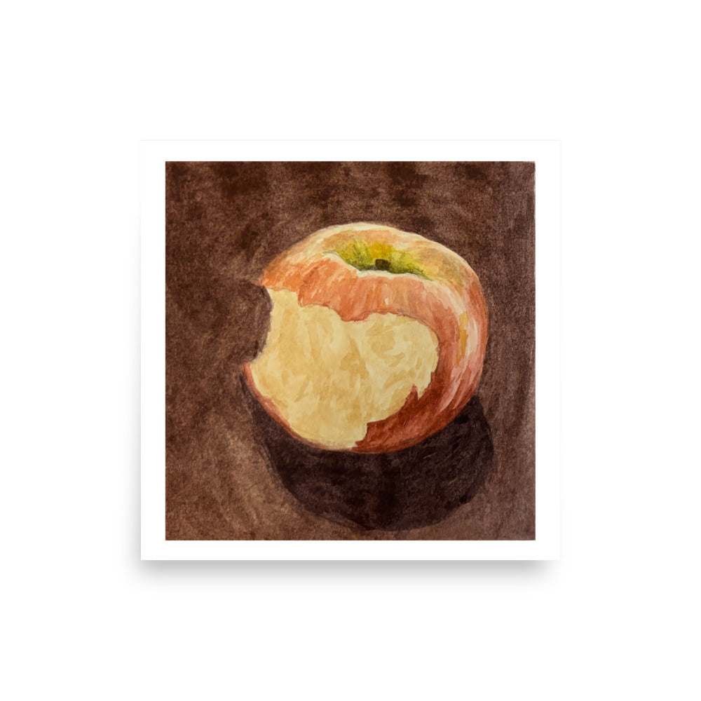 Product mockup of a watercolor painting print that depicts a red apple with a bite against a brown background 