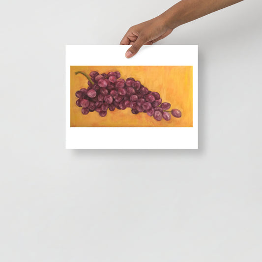 Product mockup of an oil painting print that depicts purple grapes against a yellow background