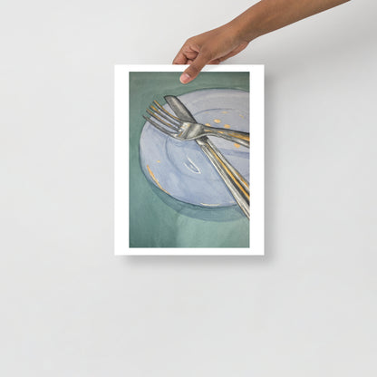 Product mockup of Silver fork and knife on a light blue plate with gold dots against a green background