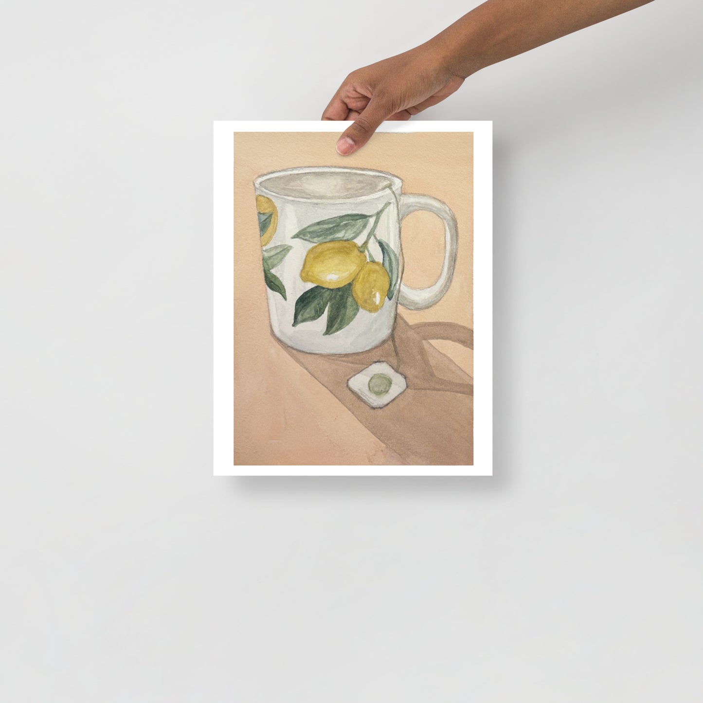 Product mockup of Ceramic mug with lemon design on a beige background