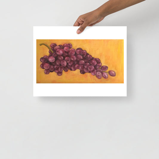 Product mockup of an oil painting print that depicts purple grapes against a yellow background