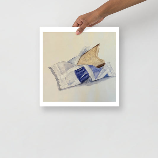 Product mockup of a watercolor print that depicts an artistic depiction of a candy half opened on a white background 