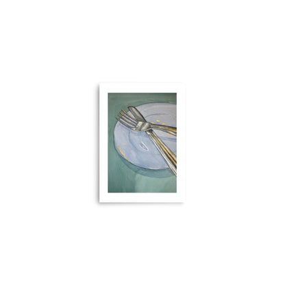 Framed artwork of a plate with silverware on a green background