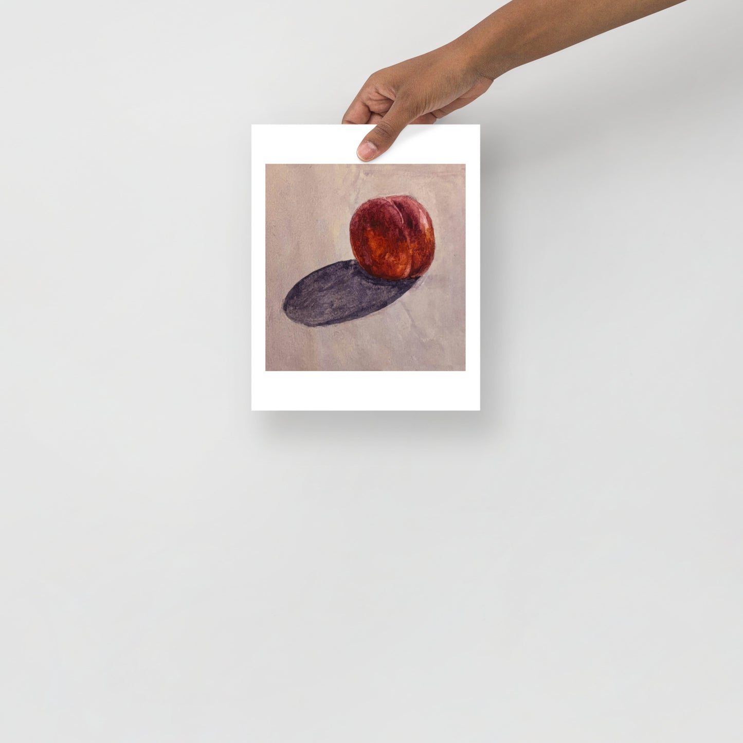 Product mockup of a watercolor painting of a peach on a textured beige background