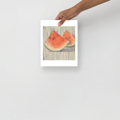 Product mockup of Two watermelon slices on a striped fabric background