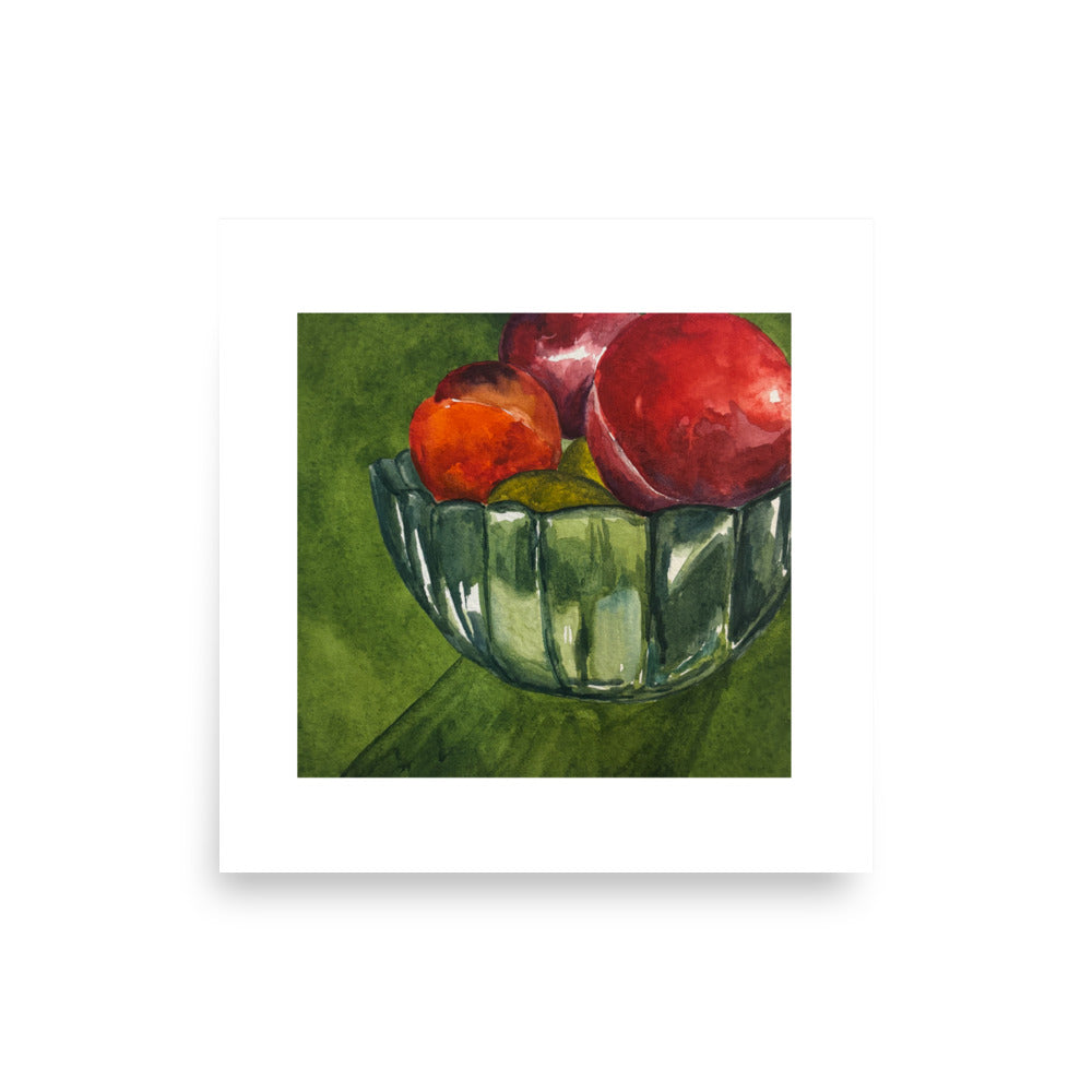 Product mockup of a watercolor painting print that depicts a green bowl with red fruit against a green background. 